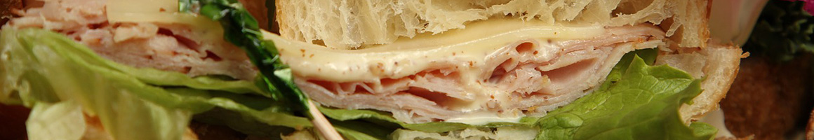Eating Pizza Sandwich at Fox's Pizza Den Ligonier restaurant in Ligonier, PA.